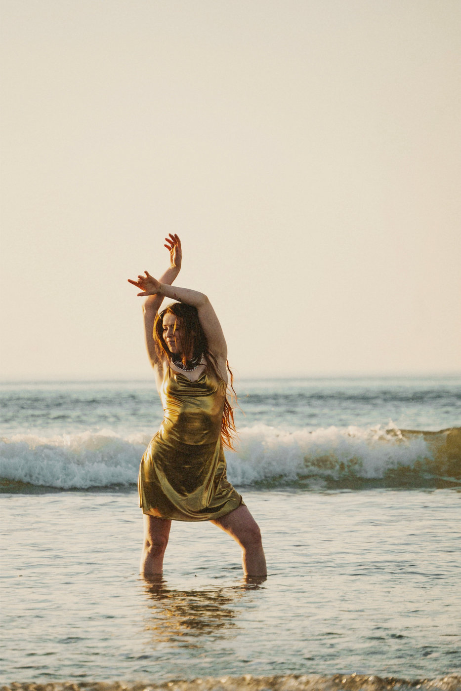Emba dancing in the waves on a Pembrokeshire beach