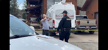 Distraught man at crime scene.jpg