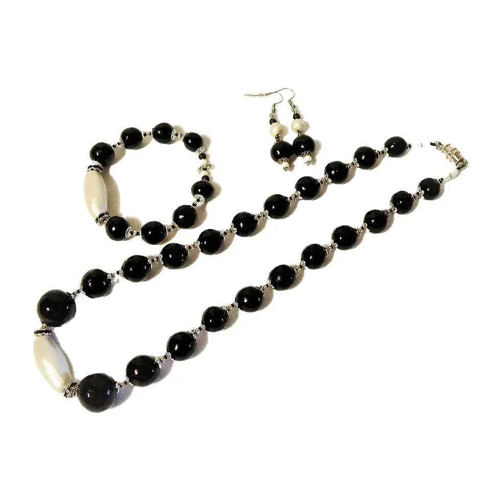 Women's adornment, necklace, bracelet and earrings, black and white color