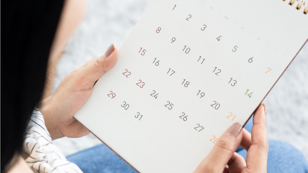woman looking at calendar