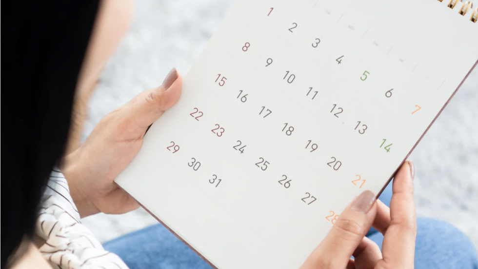 Woman looking at calendar