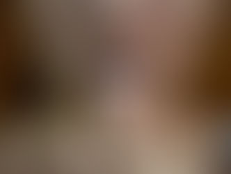 Woman holding white abortion pill up to her mouth