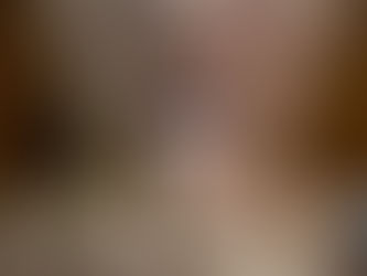 Woman holding white abortion pill up to her mouth