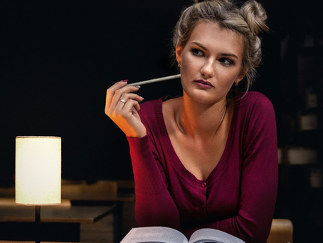 woman sitting in the library thinking