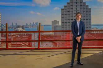 Real estate developer Justin Oates standing on the 23rd floor of a building under construction in Brickell, Miami.