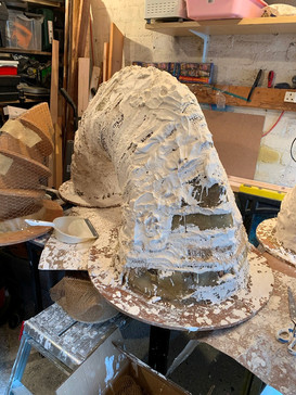 Building up the form in layers of plaster