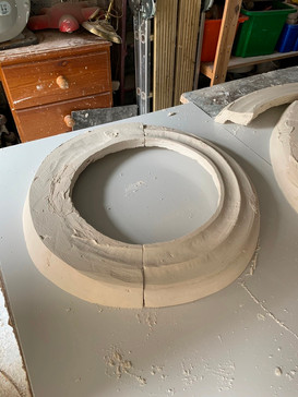 Casting and shaping plaster rings to cover the base fixings