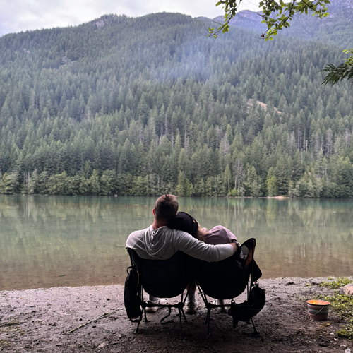 Picture of couple sitting by the river 