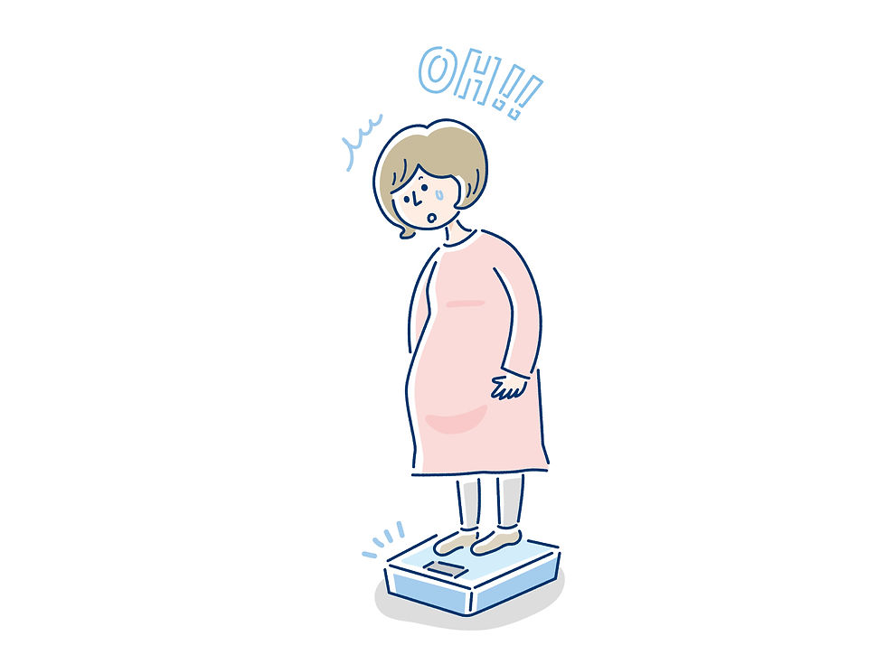 体重を計る妊婦