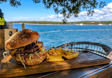 gourmet-burger-and-fries-served-at-a-restaurant-ne-2026-03-18-06-56-17-utc.jpeg