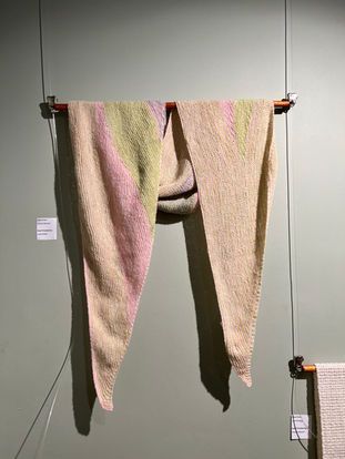 Pastel pink, white, and green scarf hanging