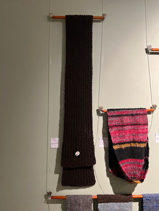 Brown hanging scarf with sheep pin