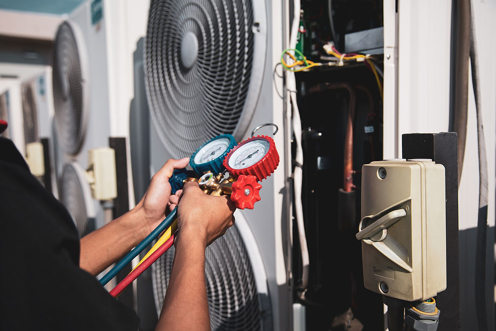 Heat and Air Conditioning, HVAC system service technician using measuring manifold gauge c