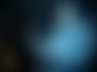 Woman facing holographic man in dim room. She looks thoughtful, hologram gestures expressively. Blue glow dominates scene. Grief Support.