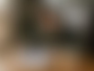 Woman reviewing dental insurance forms at kitchen table