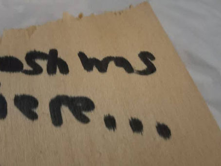 Josh was here written in black sharpie marker on wooden piece