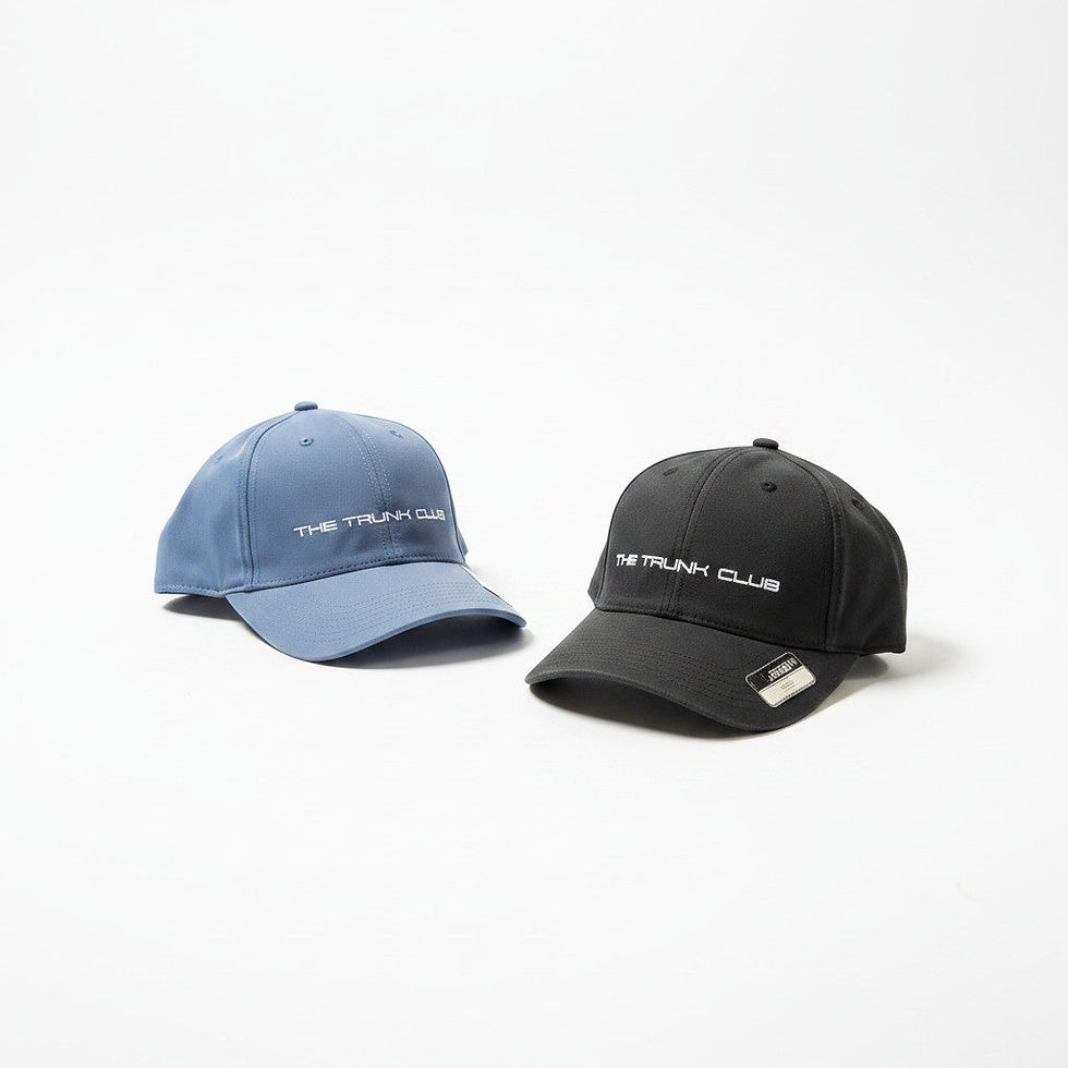 Thumbnail: Two embroidered caps on a white surface, one light blue and one black, both featuring automotive club-style text on the front