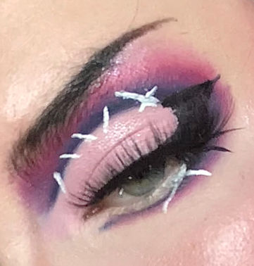 Magenta cut crease makeup with graphic liner