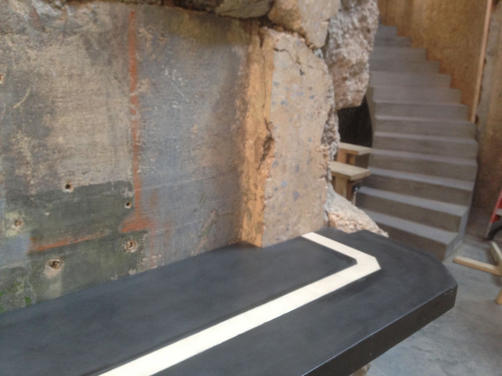 Concrete bar top fit around existing rugged concrete feature