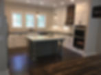 Open farmhouse style kitchen with concrete countertops