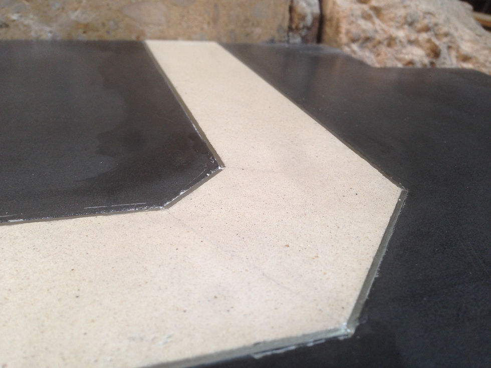Two tone concrete top with brass inlay