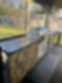 Grilling station with concrete countertops on screened porch
