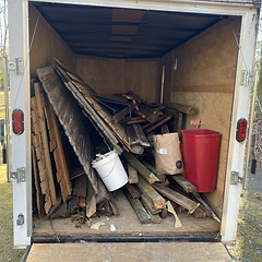Photo of a half full trailer during a junk removal job