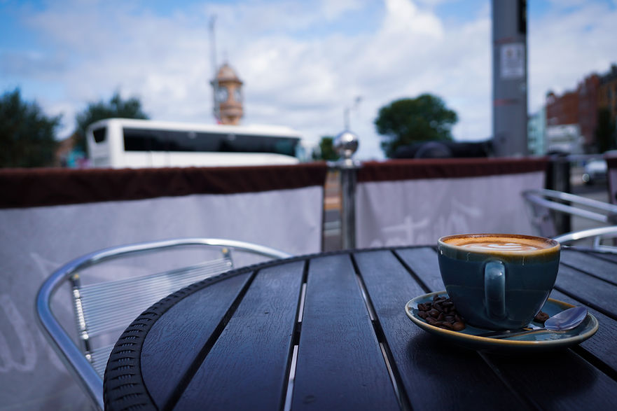 Olive Tree Coffee on a table outside the Olive Tree in Bangor