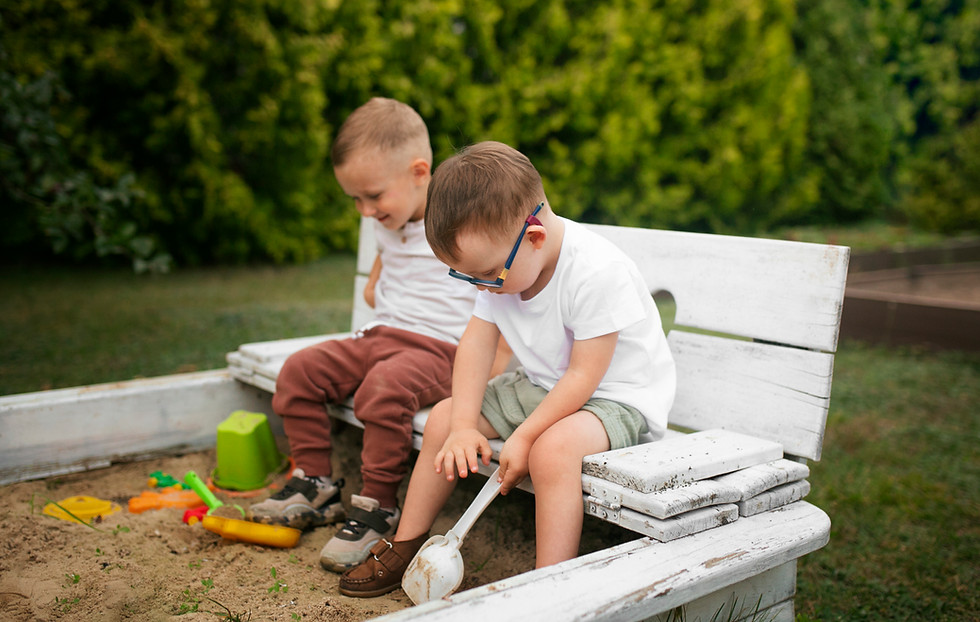 side-view-kids-sitting-outside.jpg