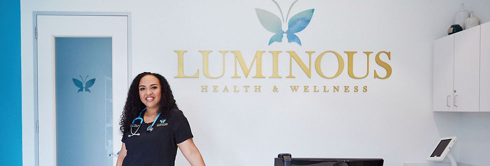 Dr. Medina Galvan is standing at the front desk with the Luminous logo behind her.