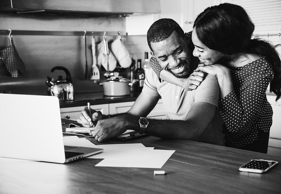african-couple-hugging-together-kitchen.jpg