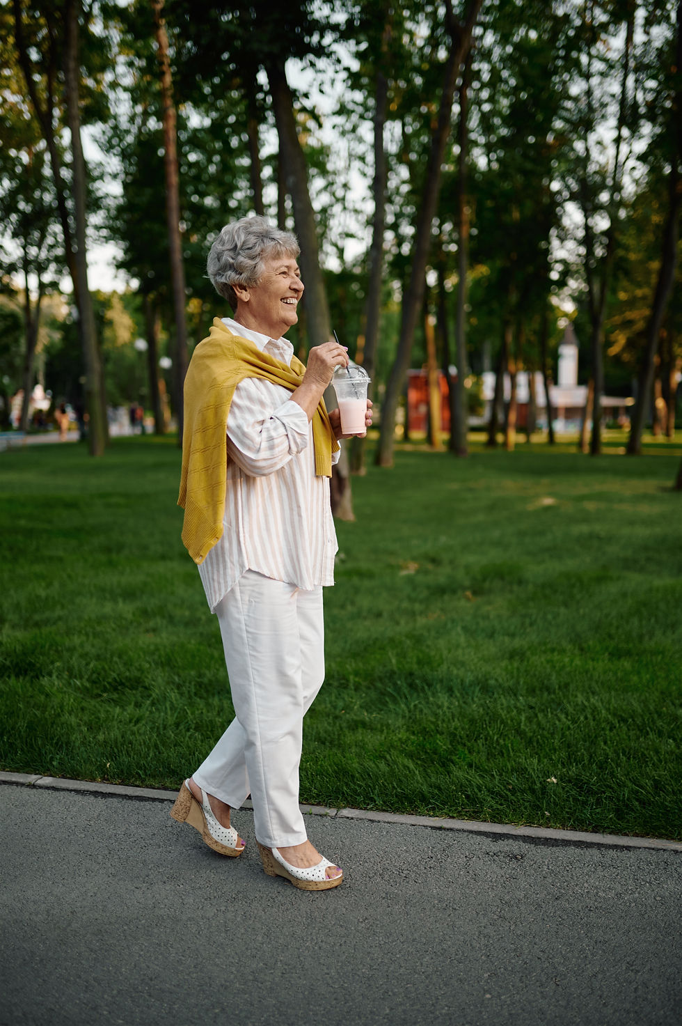 smiling-granny-holds-milk-coctail-summer-amusement-park-back-childhood-aged-people-lifesty