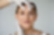 hands-with-gloves-holding-woman-s-face-front-view.jpg