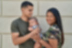 hispanic-family-smiling-confident-hugging-each-other-isolated-brick-background.jpg