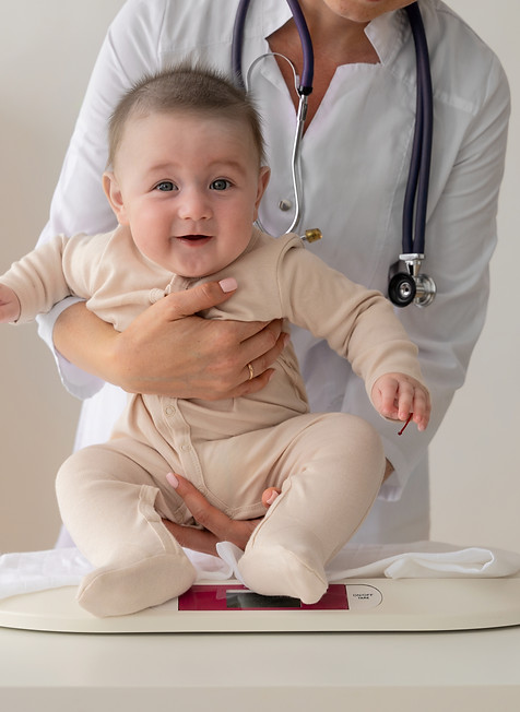 doctor-holding-cute-baby-front-view