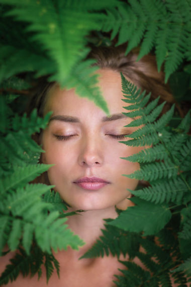 portrait-caucasian-woman-large-green-fern-leaves-closeup-grass.jpg