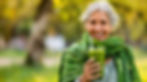 healthy-senior-woman-smiling-while-holding-some-green-juice