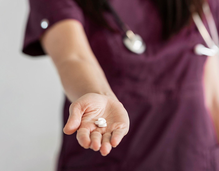 close-up-doctor-holding-medicine.jpg