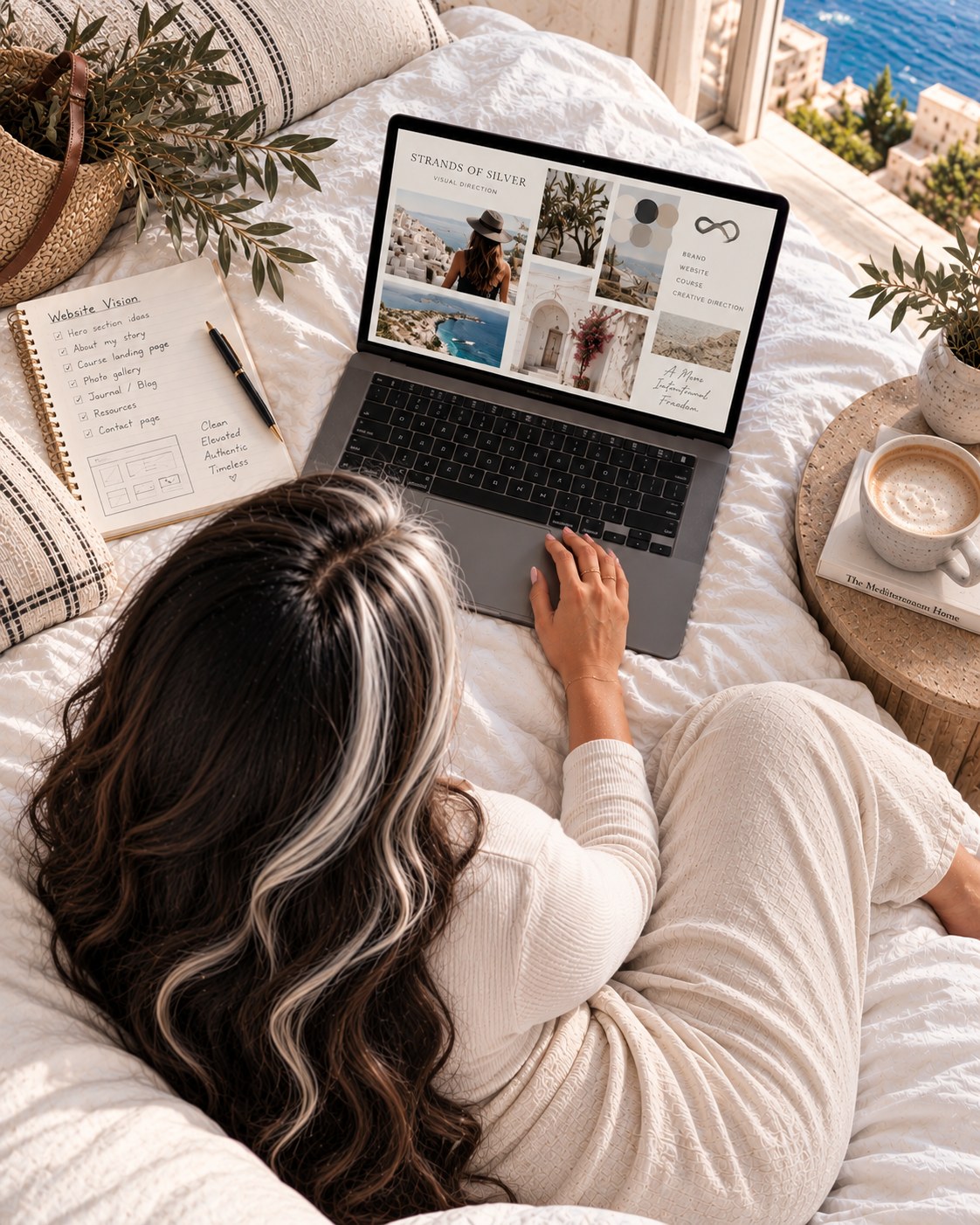 Laptop open on a bed