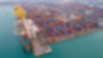 Shipyard industry shipping seafaring vessel at sunries. Cargo container depot port logisti