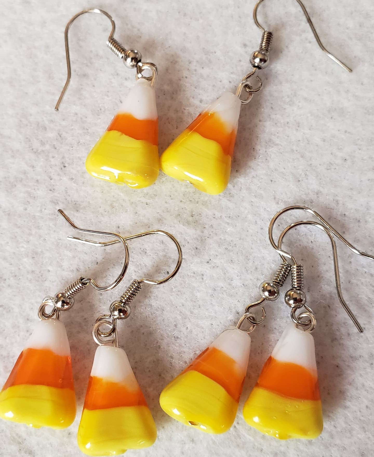 candy corn earrings shown out of packaging