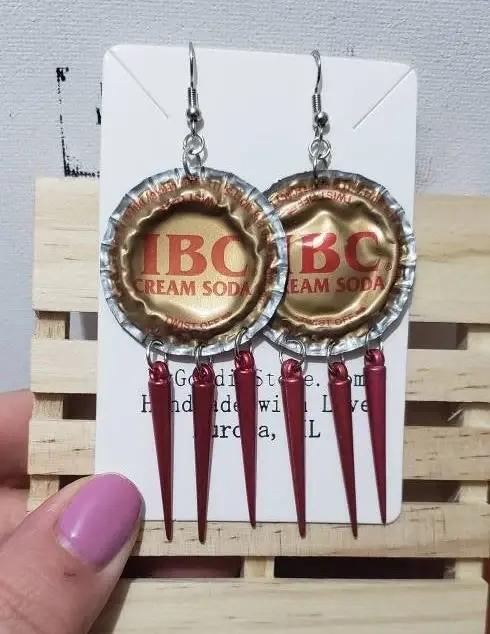 recycled soda cap earrings gold and maroon with dangling spikes
