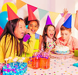 Children enjoying a sensory-friendly party with face painting and balloons in Bray