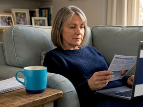 Woman reviewing NHS-accredited care pamphlet