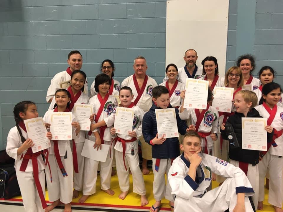 Red Belts showing off their certificates