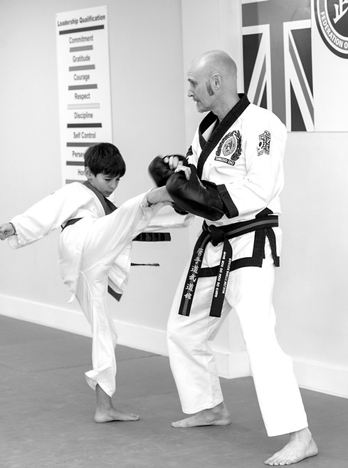 Student demonstrating a kick
