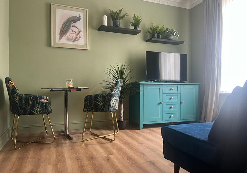 living area with bistro table and tv.jpg