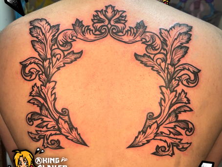 Discover the art of Black Filigree with this stunning back tattoo design. Embrace timeless style and elegance with Black Filigree tattoos.
