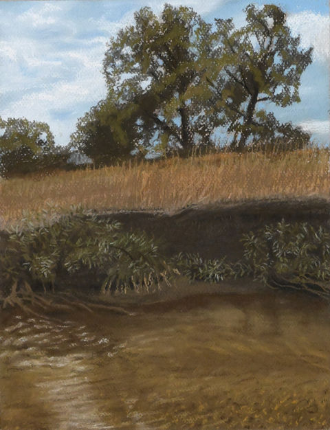 river flowing under cliff