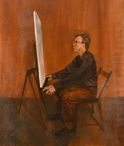 man sitting at easel